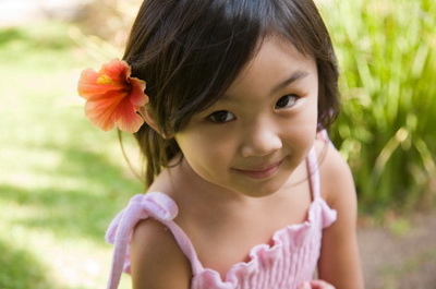 Little girl with flower in her hair